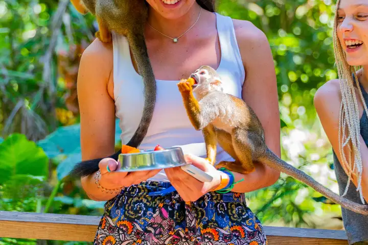 a woman standing in front of water