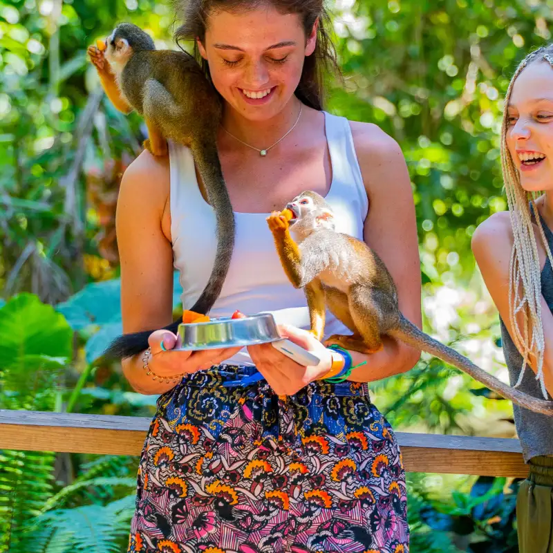 a woman standing in front of water
