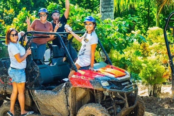 a young child riding on the back of a truck